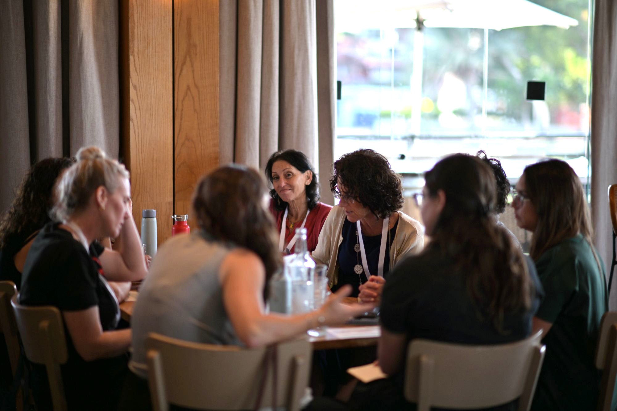 Capacity building cluster-RESIZED FOR WEBSITE women in meeting